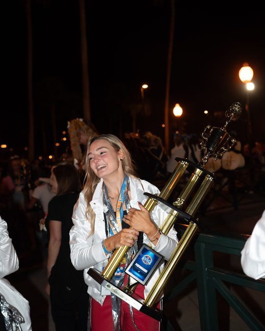 Mel Bull holding the national championship trophy