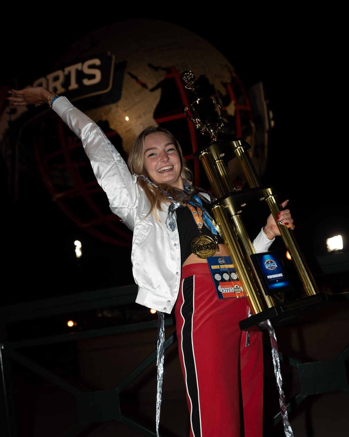 Mel Bull celebrating with a national championship trophy